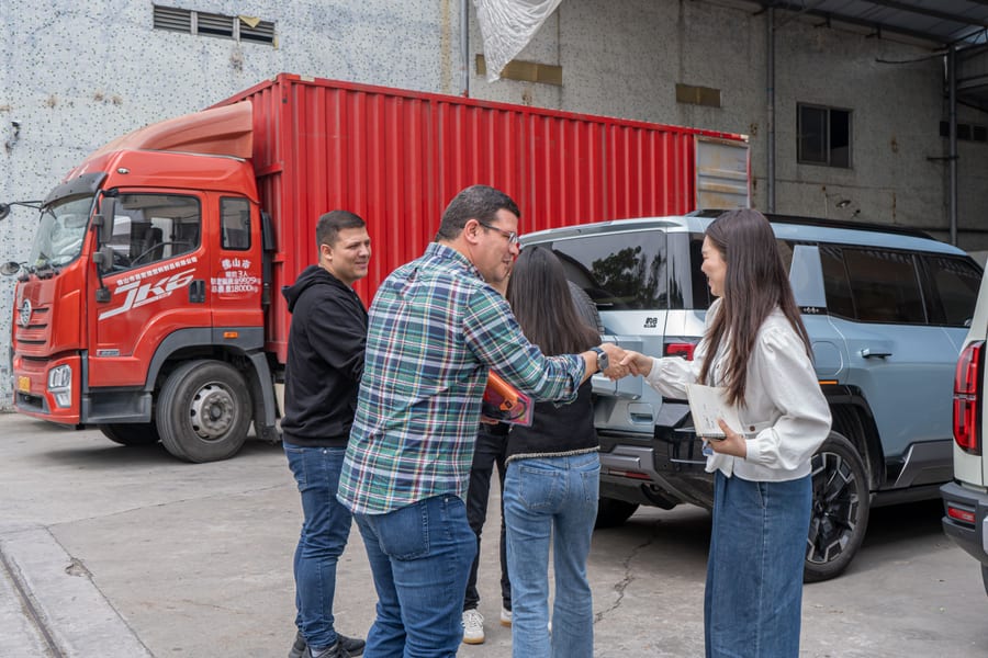Business handshake at shipping dock