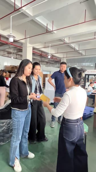 Staff discussing product specifications with clients