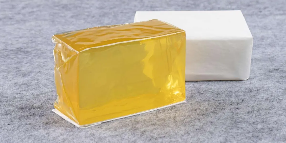 Wrapped hot melt adhesive blocks in clear and amber colors